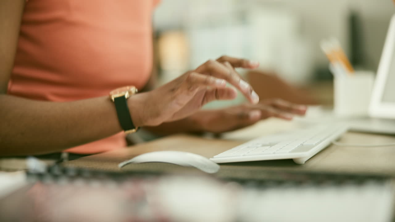 Person Typing on a Computer Keyboard