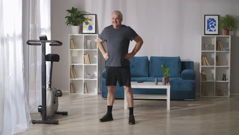 middle-aged-man-is-doing-tilts-during-morning-gymnastics-warming-body-and-training-muscles-keep-health-of-joints