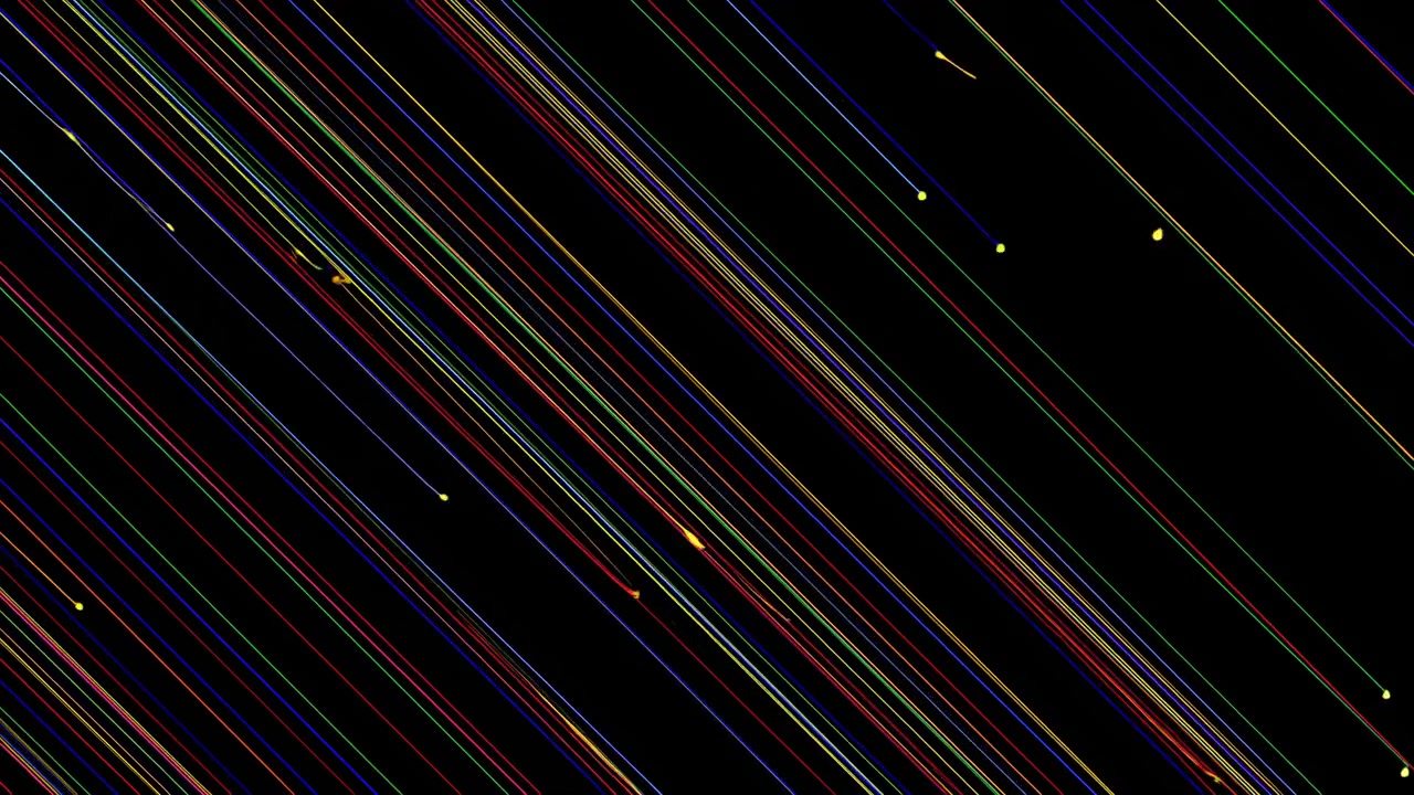 Diagonale fargestriper flyr gjennom rommet, raske vinklede spor med små gnistpartikler og lysende prikker