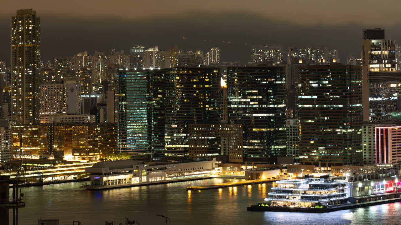 HONG KONG - 19 MARCH 2025 : timelapse of the Hong Kong city skyline from a high vantage point at night