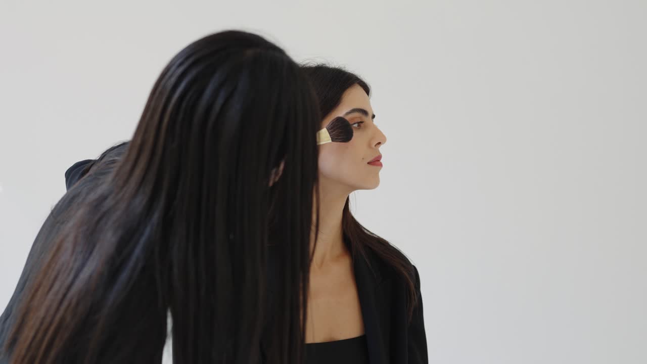 Makeup being applied to a model