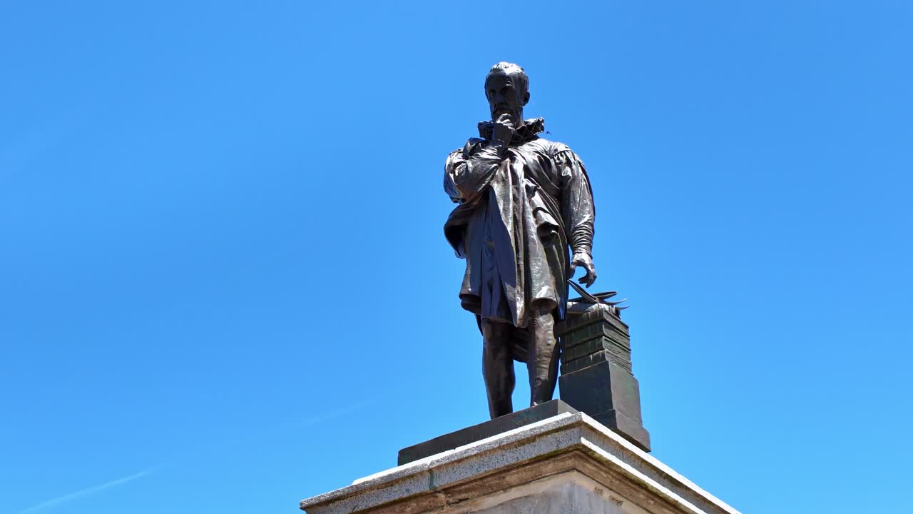 Drone shot descending from top of restored Ambroise Paré statue in Laval, now installed near 11 Novembre Square - France