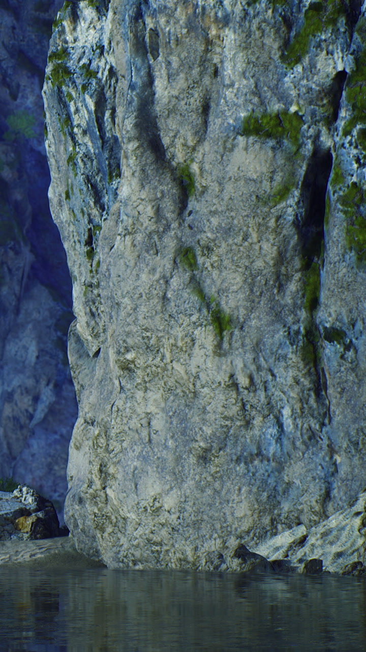 Majestic rock formation reflects in tranquil water under soft lighting