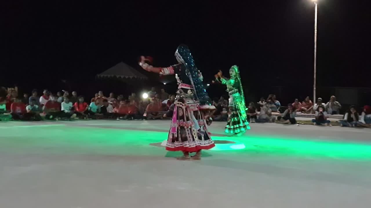 Women performing Kalbeliya dance for a group of tourists. It is an integral part of Kalbelia culture. Live tribal folk music. The Thar Desert.