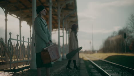 women waiting for a train