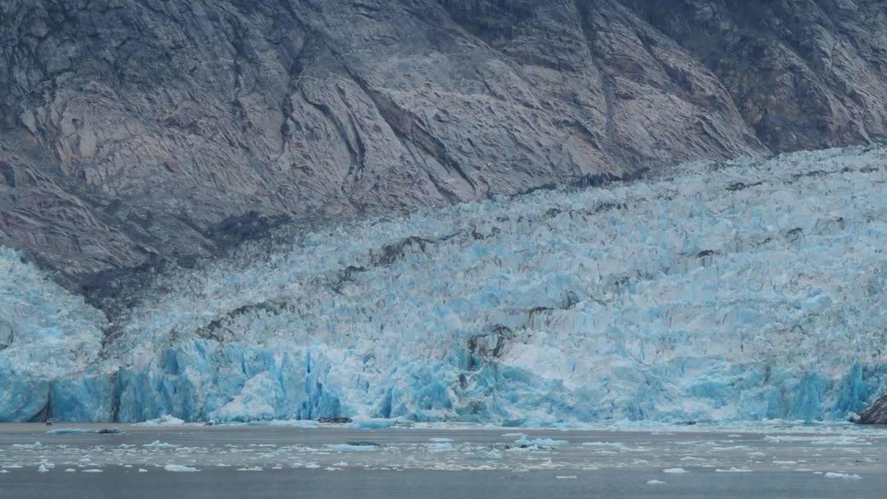 Bright blue color of the Dawes Glacier, Endicott Arm fjord, Alaska.