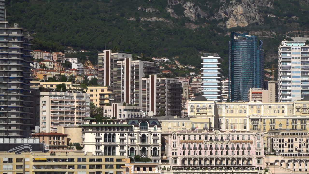 La Condamine, Monaco - July 4, 2025: View of the Monaco skyline from the Port Hercule in the evening