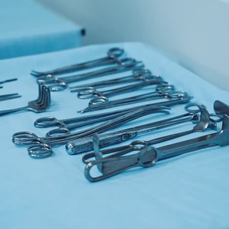 scrub nurse preparing surgical instruments for operation