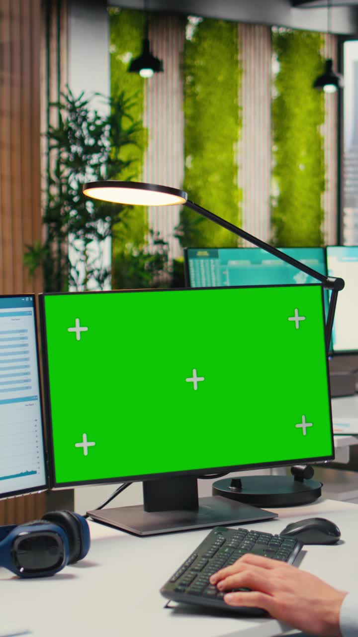 Vertical Video Young businessman reviewing financial data next to isolated mockup