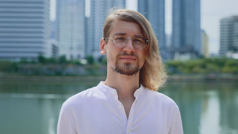 man with glasses in urban park