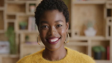 close up portrait of cheerful african american woman smiling enjoying lifestyle successful black female entrepreneur wearing stylish fashion slow motion