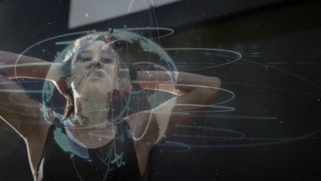 Light-trails-over-spinning-globe-against-african-american-fit-woman-flipping-her-hair