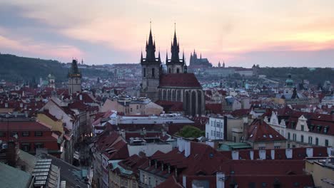 day to night sunset timelapse of the prašná brána , old town hall, prague castle and downtown prague, czech republic as it lights up during the night