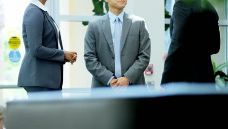 ambitious multi ethnic business executives in office meeting