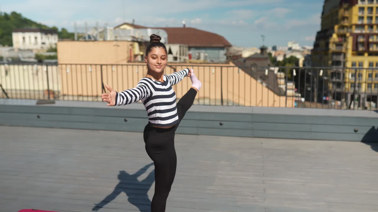 Teenager Practicing Yoga on a Rooftop