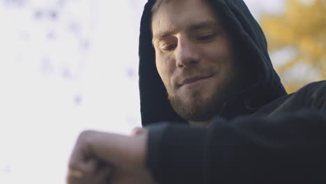 man checking time outdoors