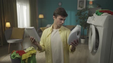 confused young man choosing laundry detergent