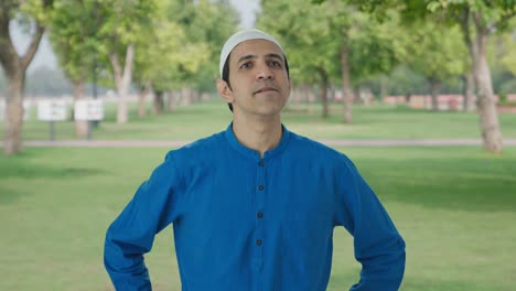 confused muslim man thinking about something in park