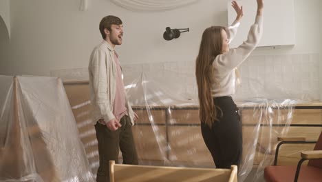 couple dancing in newly renovated kitchen