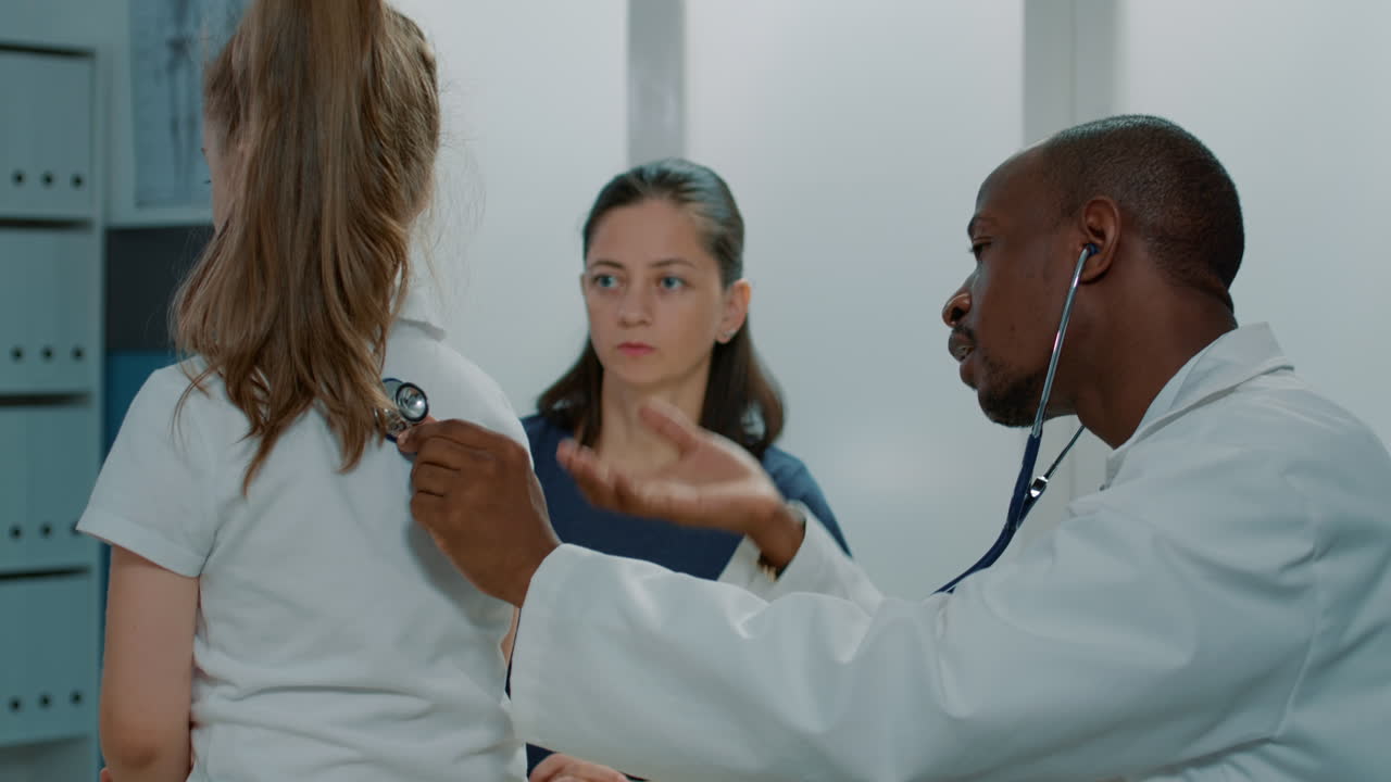 Doctor Examines Child with Stethoscope