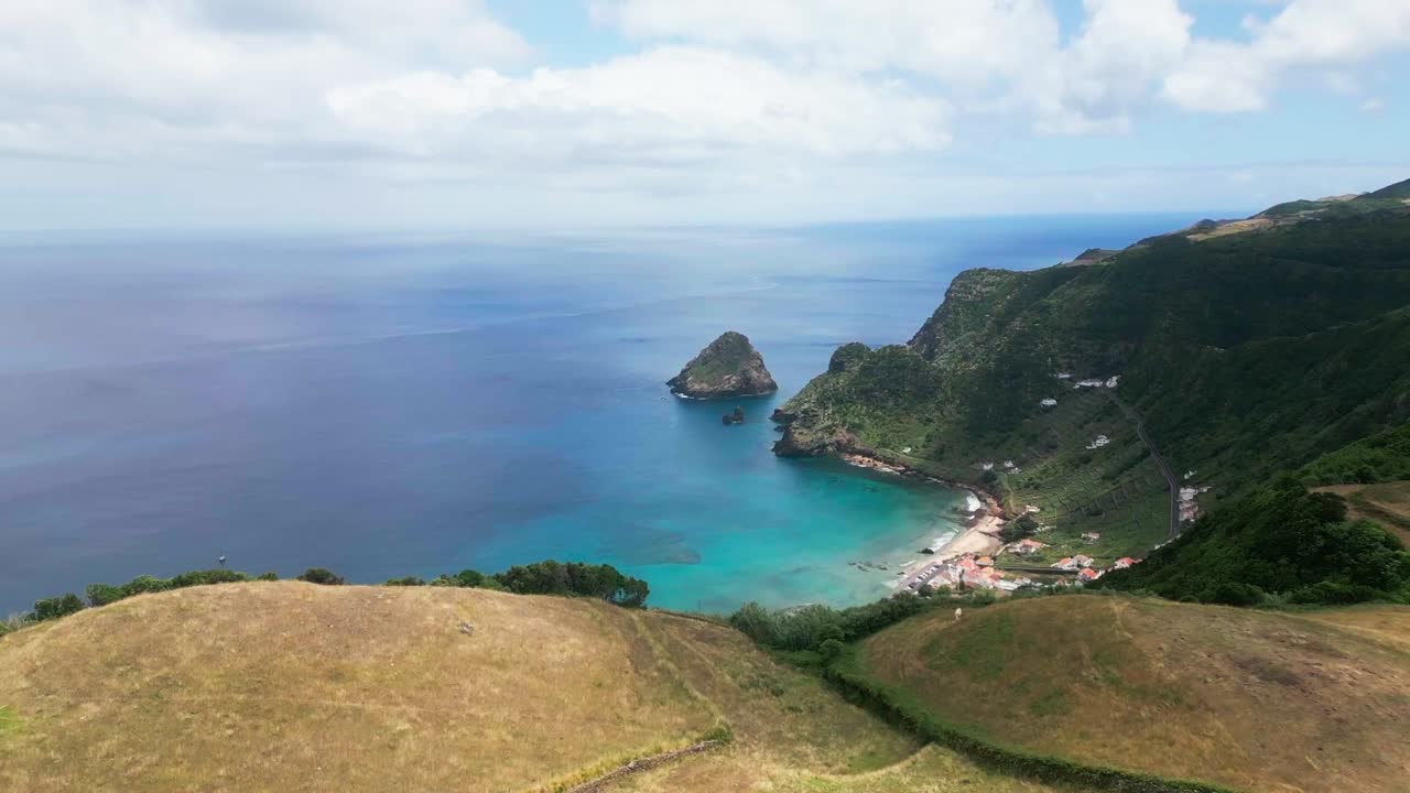 Santa maria island's praia de são lourenço with vibrant blue ocean and green cliffs, aerial view