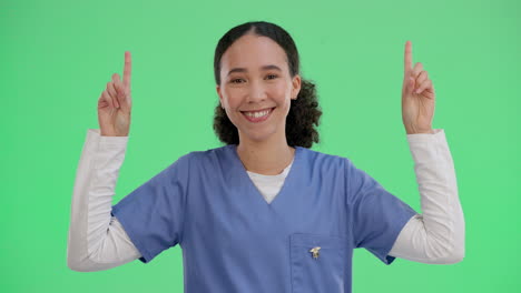 medical professional pointing up on green screen