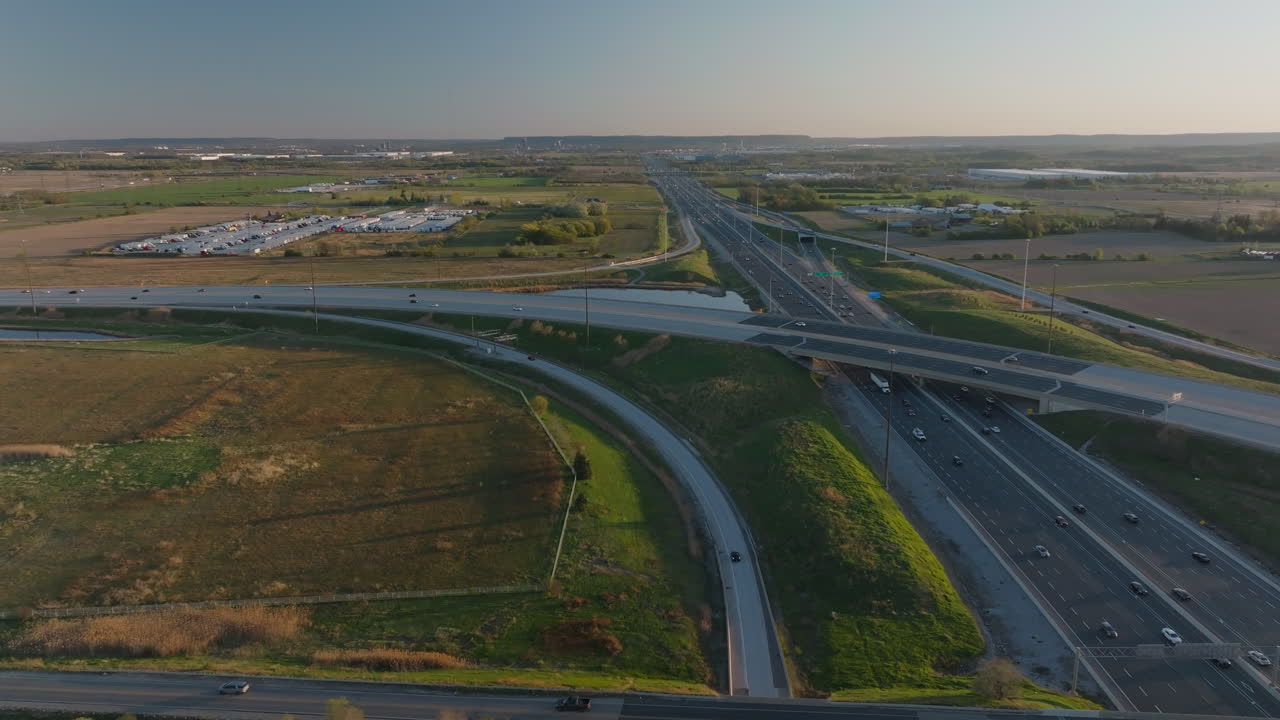 Highway 401, mississauga, showing road junctions, fields, and factories, aerial view