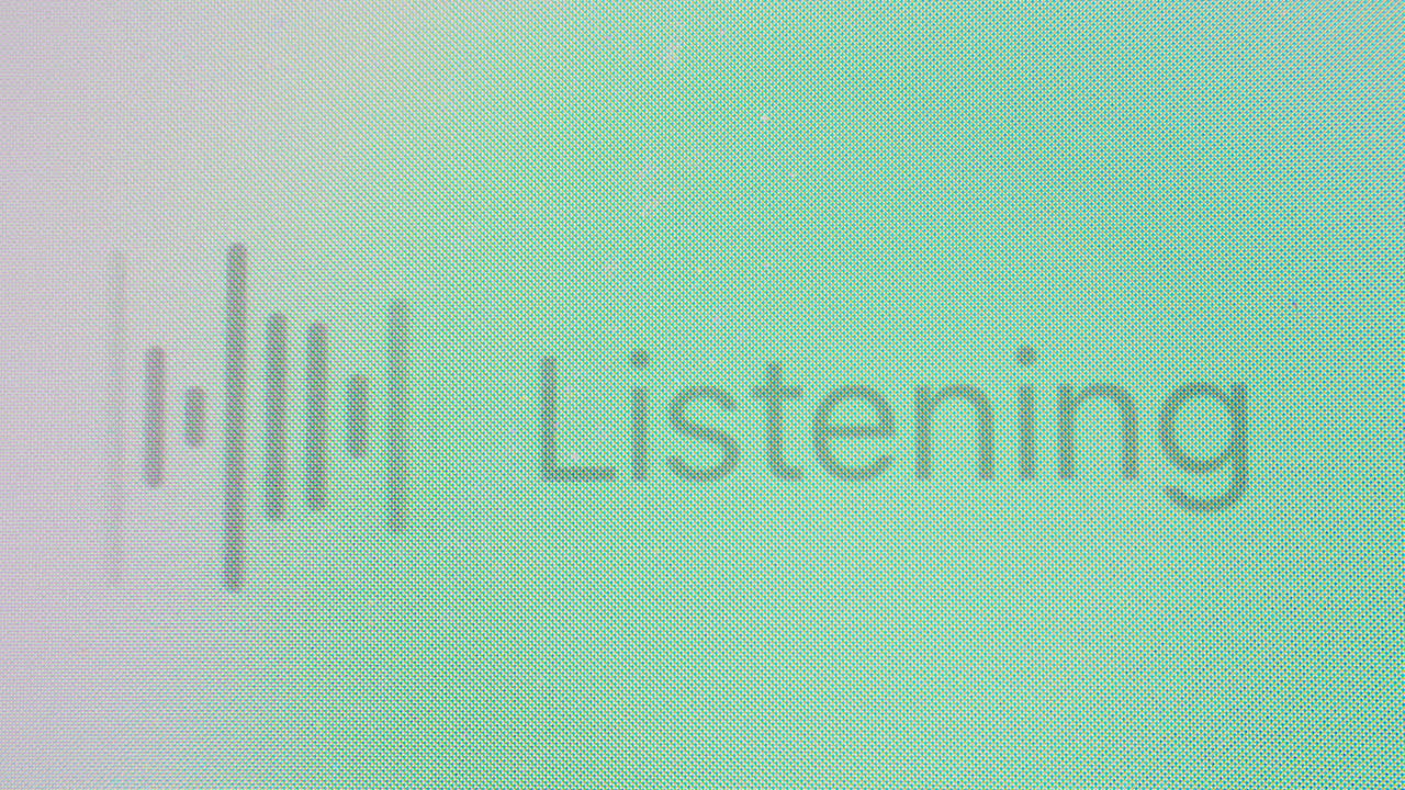 Animated 'Listening' Text with Sound Wave Graphic on Screen