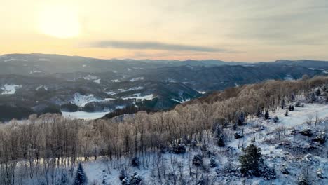 aerial winter push in to sunset near boone nc, north carolina