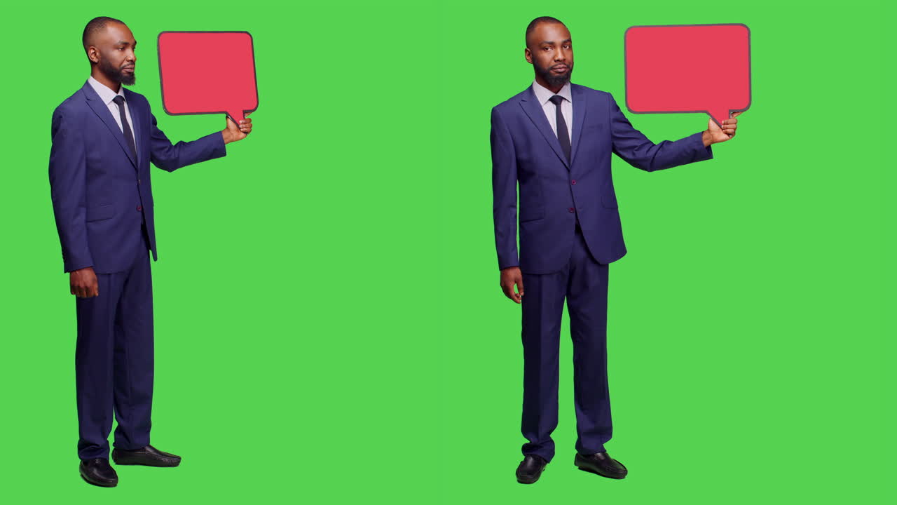 African American Businessman Holding Speech Bubbles on Green Screen