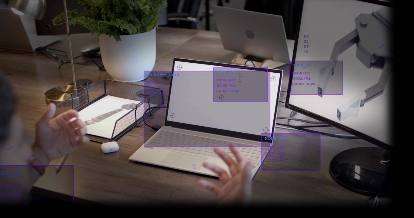 Male hands entering frame, gesturing above laptop and making purple HUD boxes adjust for AR test