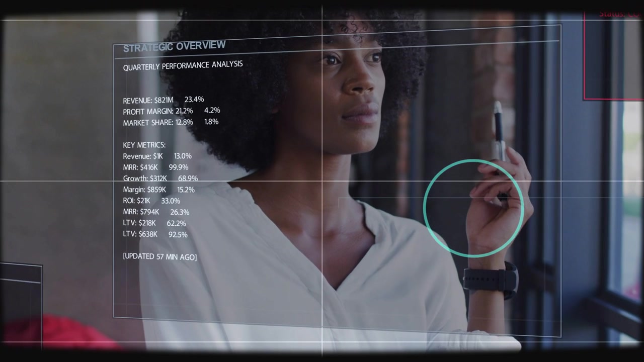 After HUD appearing, analyst nudging watch into reticle, studying business metrics, planning action