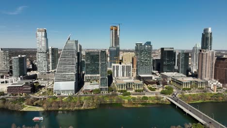 aerial shot of downtown austin, tx with the colorado river in frame