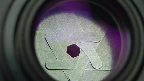 camera lens aperture diaphragm iris opening and closing when taking pictures