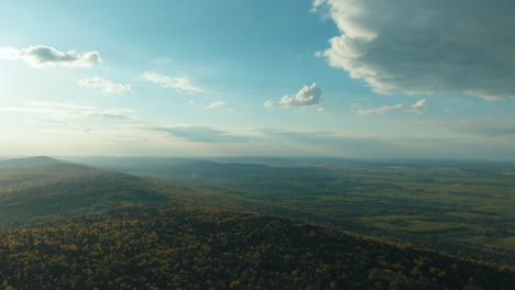 Aerial View of Mountainous Landscape with Forests and Valleys
