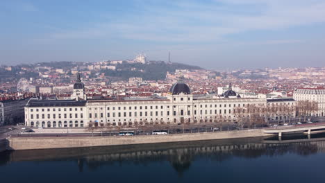 affluent riverside building of hotel-dieu de lyon on the west bank of rhone river in lyon, france