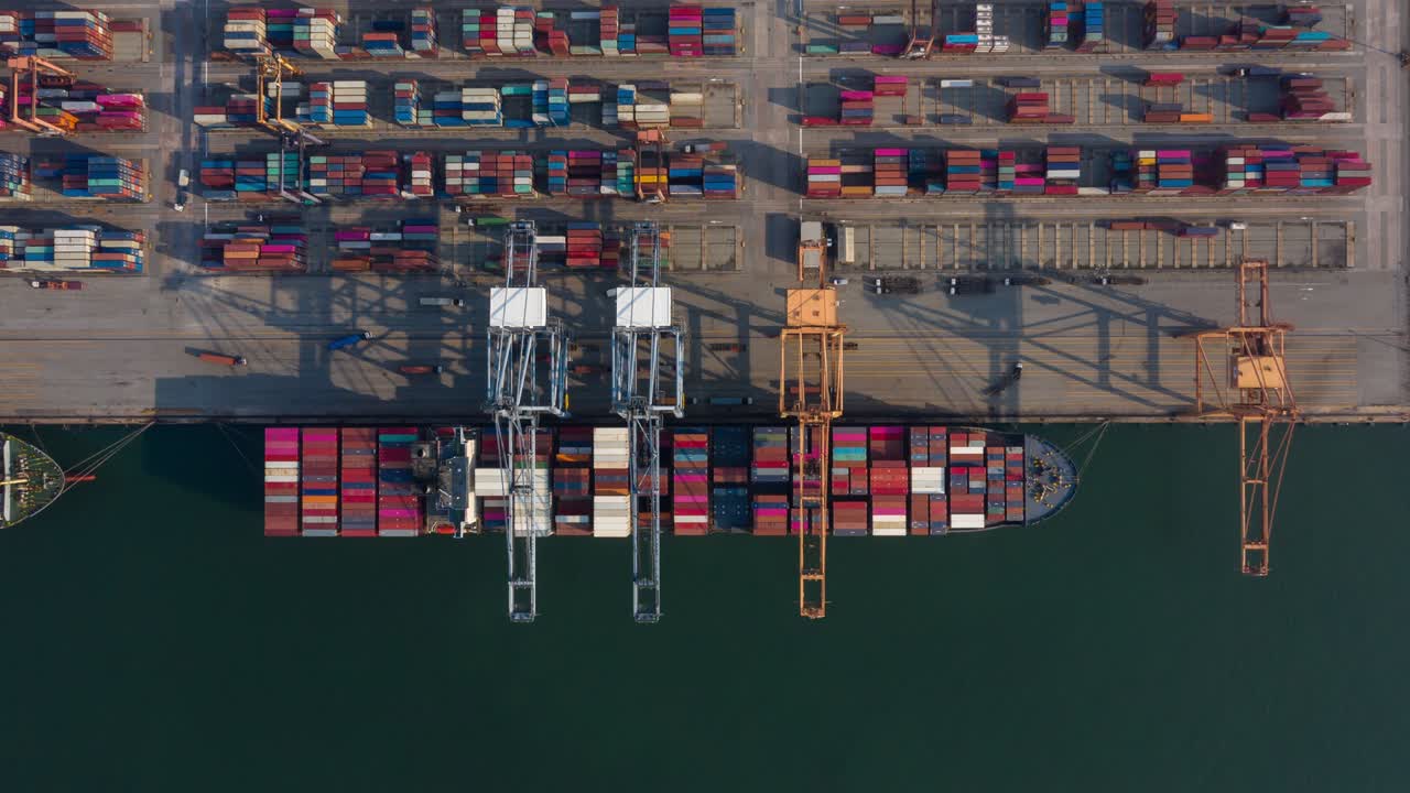 Time lapse,Hyper lapse ,Container , container ship in export and import business and logistics. Shipping cargo to harbor by crane. Water transport International. Aerial view and top view.