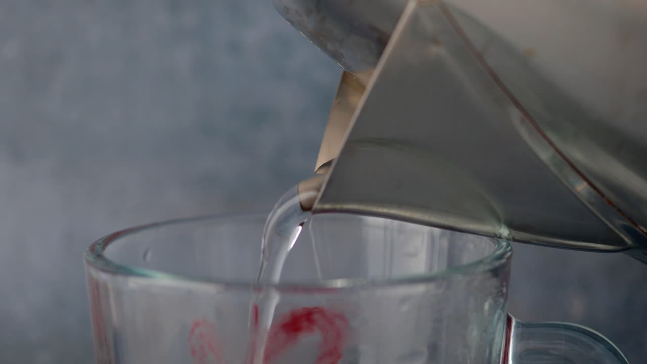 Pouring Hot Water into a Cup