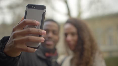 couple taking silly selfies