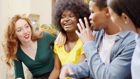 diverse group of friends engaging in an intense outdoor conversation