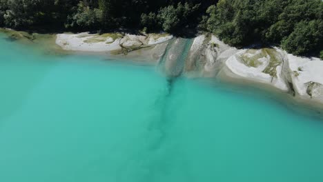 Fresh-water-from-mountains-enters-green-glacier-lake