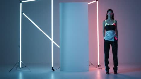 a dynamic fashion showcase featuring a model in modern athletic wear, illuminated by striking neon lights in a minimalist studio setting