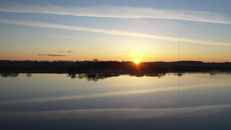 sunrise over a tranquil lake