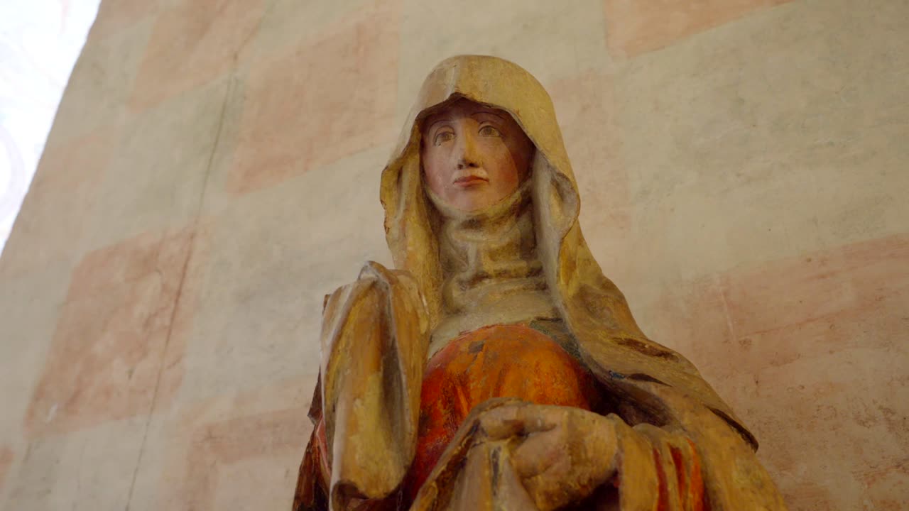A figure of the Virgin Mary, part of the furnishings in a historic castle hall