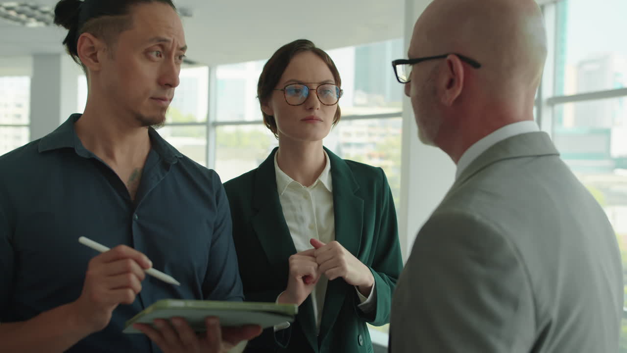 Employees Giving Feedback to Male CEO about Project Tasks