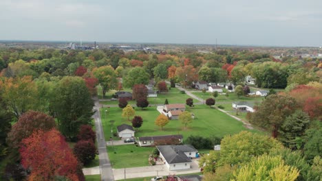 drone footage over small town during autumn