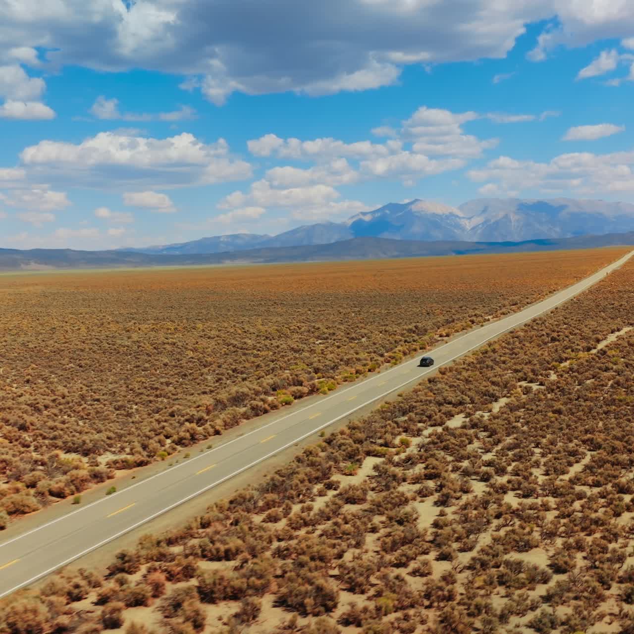 Highway riding desert road. Car driving along the road in the valley
