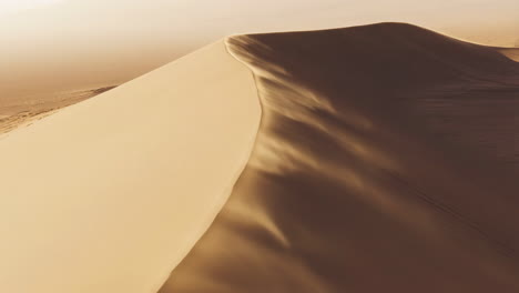 aerial view of a sand dune in the desert