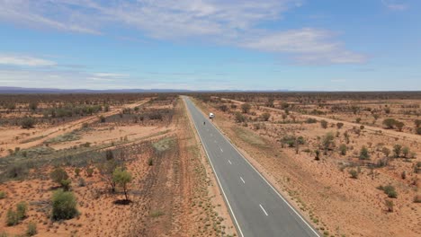 tourists and camper van on remote highway