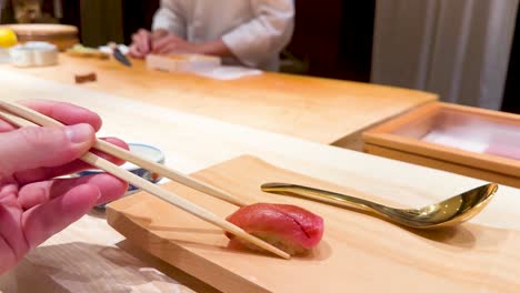 chef prepares sushi at a japanese restaurant